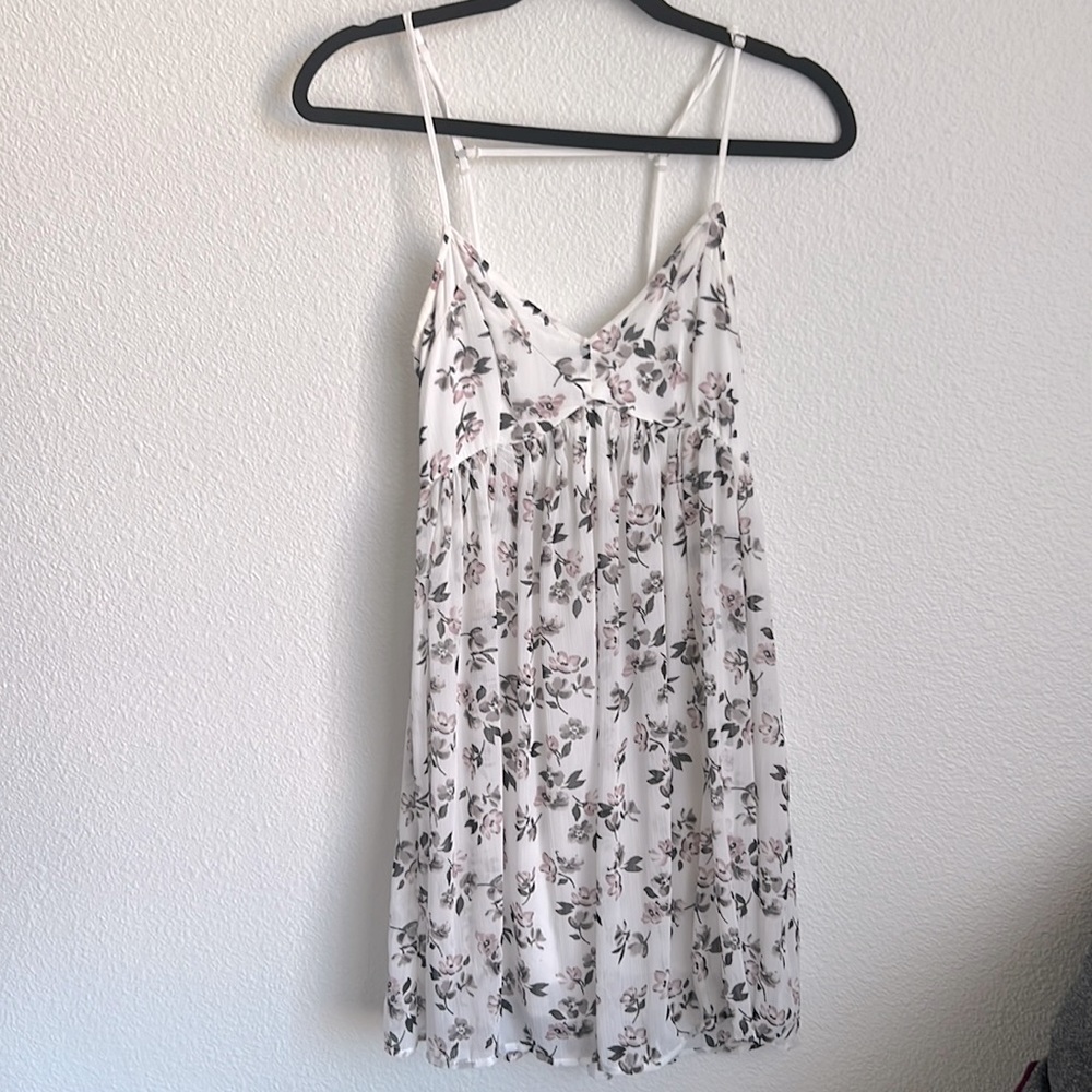 Hollister white dress with purple and grey floral pattern. Size Small